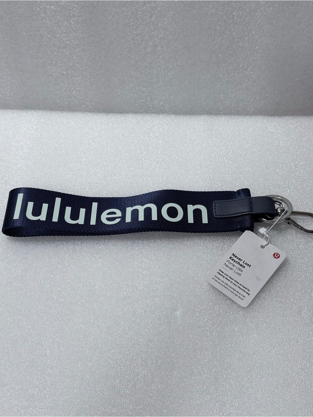 Lululemon Never Lost Keychain in True Navy and White.